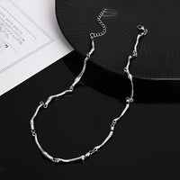 Connected Bones Metal Necklace — dettaglio