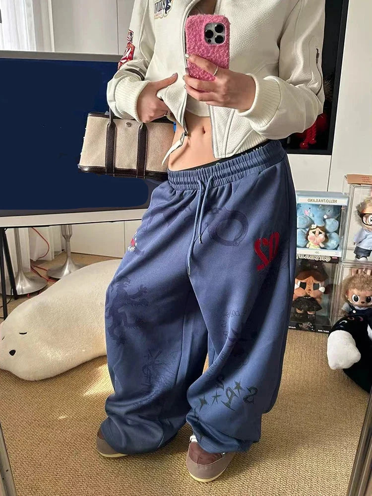 Baggy Blue Graphic Sweatpants Joggers Trousers — vista laterale