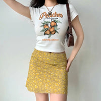 Butterfly Print Yellow Mini Skirt — dettaglio