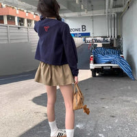 Essential Ruffle Mini Skirt — dettaglio della stampa
