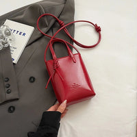 Mini Leather Crossbody Handbag — in alternativa