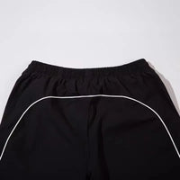 Piping Parachute Trousers — dettaglio della stampa