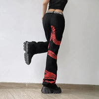Red Snake Print Graphic Jeans — dettaglio della stampa