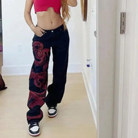 Red Snake Print Graphic Jeans — dettaglio del tessuto