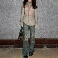 Tattoo Print Vintage Distressed Flare Jean — dettaglio della stampa