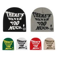 "There's Never Too Much!" Slogan Beanie — dettaglio del tessuto